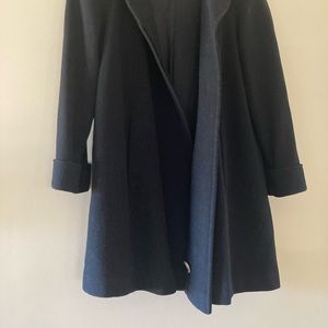 Black wool swing coat.